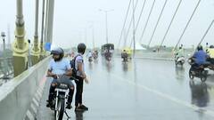 Delhi residents welcome rains, step out to click pictures