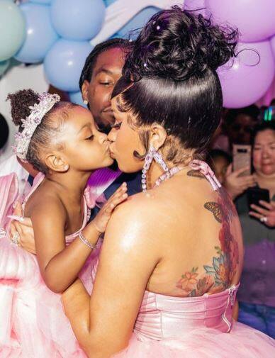 Birthday girl Kulture had a smile on her face as her mother held her close. [pic credit: Instagram/Cardi B]