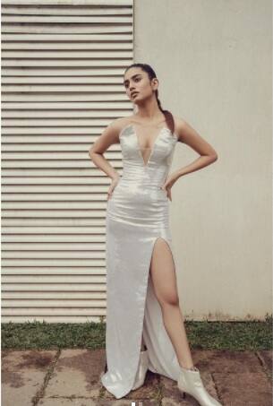 The Mollywood heartthrob flaunts her slender frame in a thigh-high slit strapless dress. (All photo credit: priya.p.varrier)