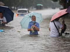 China Flood: சீனாவில் 1000 ஆண்டுகளில் இல்லாத பெருமழை... காலநிலை மாற்றத்தால் மக்கள் அவதி!