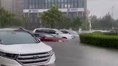 China Floods: Vehicles & Cities submerged in water; Red alert issued