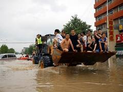 China Rains | சீன வெள்ளத்தின் கோர முகத்தைக் காட்டும் புகைப்படங்கள்!
