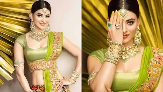৬২ লক্ষ টাকার বান্ধনি লেহঙ্গা লুকে এই ছবি এই বিয়ের অনুষ্ঠানেরই, যেখানে উর্বশী ৬২ লাখি খরচের লুক ক্যারি করেছিলেন। উর্বশী আশা গৌতমের ডিজাইনে তৈরি ৪০ লাখের বান্ধনি লুকের লেহঙ্গা পরেছিলেন। সেইসঙ্গে ছিল জুয়েলারি।