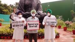 Congress leaders protest against farmers issue in front of Mahatma Gandhi's idol