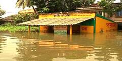 West Bengal Flood Photos জলে ভেসে গিয়েছে বাড়িঘর, বৃষ্টি কমলেও কমেনি যন্ত্রণা, জেলায় জেলায় দুর্ভোগের ছবি