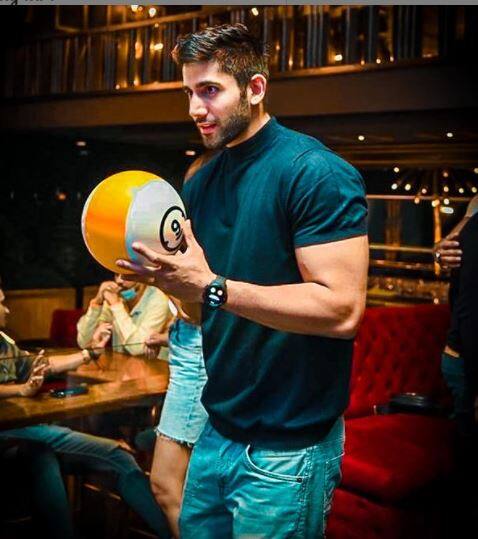 Varun trying bowling at the video game centre. [pic credit: Instgaram/Varun Sood]