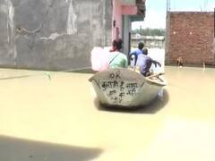 Kanpur Flood: कानपुर में घरों में घुसा बाढ़ का पानी, नाव से आने जाने को मजबूर लोग, सैकड़ों ने किया पलायन