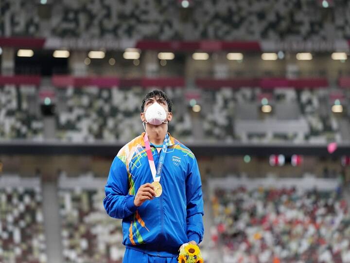 Neeraj Chopra holds his gold medal during the medal ceremony, after winning in the final of the mens javelin throw event at the 2020 Summer Olympics, in Tokyo, Saturday, Aug. 7, 2021. (PTI Photo/Gurinder Osan)
