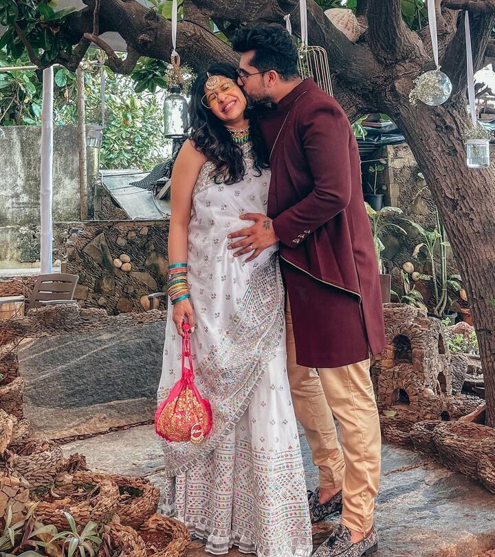 Kishwer posted a photo wherein Suyyash can be seen kissing her on her cheeks while cradling her baby bump. The couple complimented each other in traditional outfits.