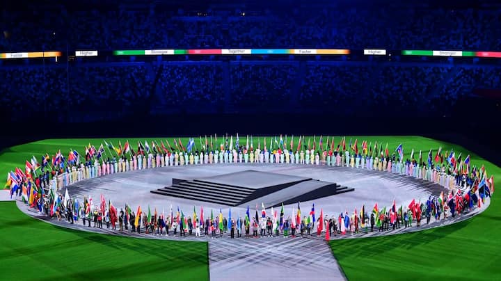 Athletes delegations arrive with their national flag during the closing ceremony of the Tokyo 2020 Olympic Games. (Image: AFP)