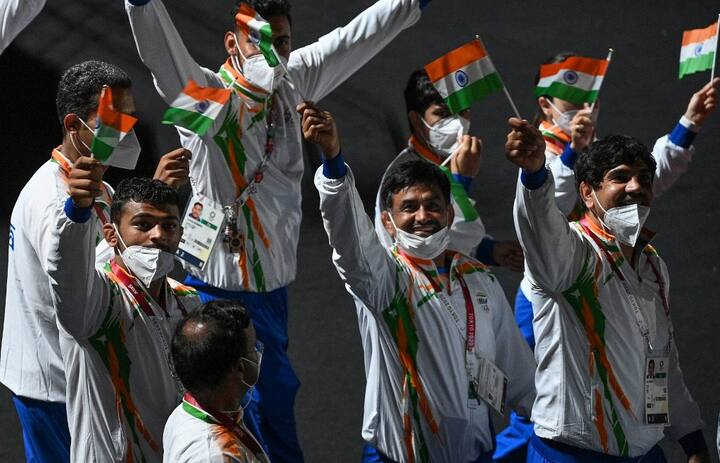 Athletes from India's delegation wave their national flag as they parade during the closing ceremony of the Tokyo 2020 Olympic Games, on August 8, 2021 at the Olympic Stadium in Tokyo. (Image: AFP)