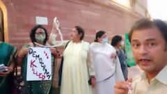 'Democracy Killed': Slogans & cards outside Parliament after Monsoon session