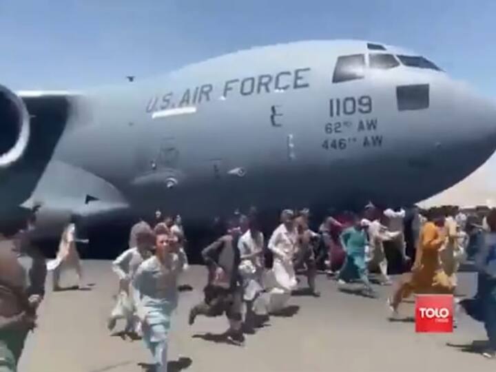 Amid desperate attempts by Afghans to leave the country, people on Monday were captured runing on tarmac of Kabul international airport as a US military aircraft attempted to take off. (Photo: Screen Grab/TOLOnews)