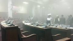 Afghanistan Parliament : আগ্নেয়াস্ত্র হাতে পার্লামেন্টে আশরফ গনির চেয়ারে বসল তালিবান