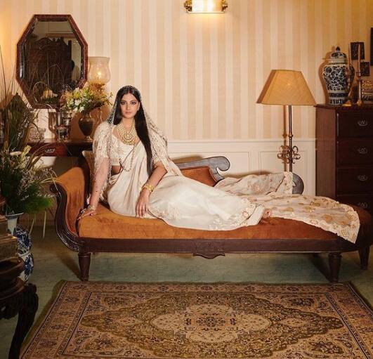 For her wedding, Rhea ditched the traditional red and opted for an off-white Anamika Khanna sari.