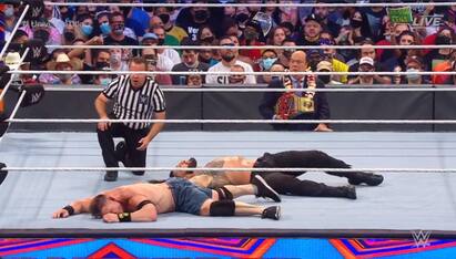 Summerslam 2021 highlights: WWEs Roman reigns defeats john cena WWE Summerslam 2021: ஜான் சீனா vs ரோமன் ரெயின்ஸ்: 17வது சாம்பியன்ஷிப்பை மிஸ் செய்த சீனா!