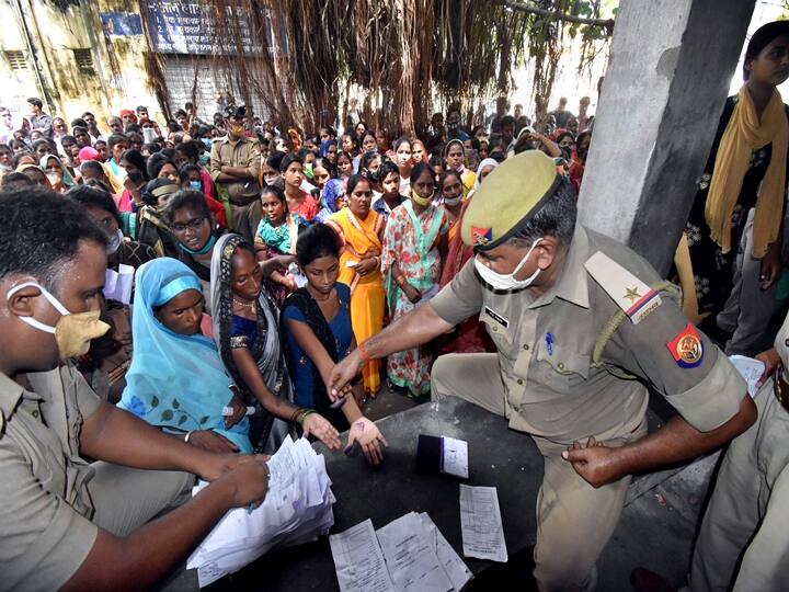Gorakhpur: Women stand for entry stamps at the Gorakhpur District Jail to tie 'rakhi' to their jailed brothers, on the occasion of Raksha Bandhan in Gorakhpur, Sunday, Aug. 22, 2021. (PTI Photo)