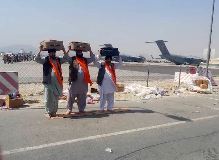 AI 1956 enroute to Delhi from Dushanbe carrying three copies of Sikh scripture and 78 passengers, including 25 Indian nationals landed at Delhi airport from Kabul. (Image Source: PTI)