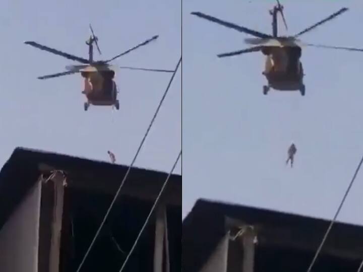 US Exit From Afghanistan Taliban Fly American Black Hawk Helicopter with Body Hanging From Rope Watch अमेरिका की अफगानिस्तान से वापसी, रस्सी से बांधकर एक शख्स को तालिबान ने उड़ाया यूएस का हेलॉकॉप्टर- देखें Video