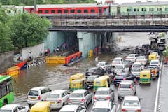 Commuters Nagivate Through Water-Logged Roads After Heavy Showers In Delhi-NCR