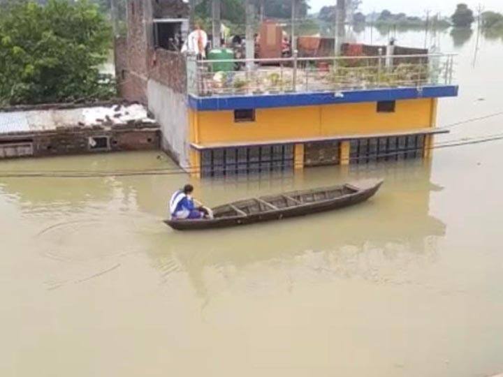 girl going to school by riding boat wins people hearts in Gorakhpur ANN Flood in UP: जज्बे को सलाम, नाव खेकर अकेले स्‍कूल जा रही बच्‍ची ने जीता लोगों का दिल