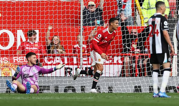 The First Goal: Cristiano Ronaldo celebrates after scoring their side's first goal during the Premier League match. It was a simple tap-in after a hiccup from the goalie. He scored another goal after this one taking his tally to two goals on the night. (Getty Images)