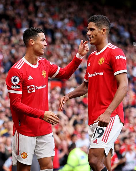 Former Real Madrid Players Unite: Cristiano Ronaldo of Manchester United with teammate Raphael Varane during Manchester United vs Newcastle United at Old Trafford. (Getty Images)