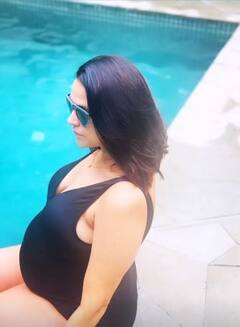 Heavily Pregnant Neha Dhupia Flaunts Baby Bump In A Black Swimsuit As Enjoys 'Pool Party For Two'- See Pics