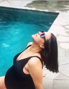 Heavily Pregnant Neha Dhupia Flaunts Baby Bump In A Black Swimsuit As Enjoys 'Pool Party For Two'- See Pics