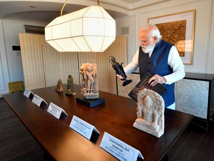 Prime Minister Narendra Modi looks on at artefacts handed over to India by US which include cultural antiquities, figurines related to Hinduism, Buddhism, Jainism. (PTI Photo)