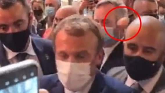 French President Emmanuel Macron hit with an egg by protester in Lyon