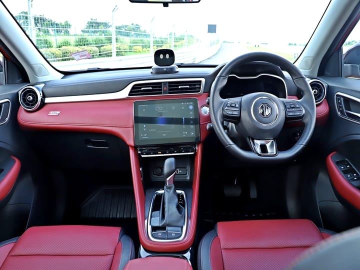 Interiors are an even better job according to us in terms of the material quality and the execution. There are three interior colour schemes including two dual-tone and all black interior. We had the red/black dual tone and combined with aluminium accents/soft touch materials, this cabin is right up there with being a possible new benchmark for cabin quality. Space wise, the Astor scores decently being a comfortable four seater with the central hump making it less comfortable for the middle passenger at back, if taken. The headroom/legroom is quite good at the back otherwise but it does feel a bit small here thanks to the rising windowline. We found the door pockets to be big enough and storage is well looked after inside the cabin.
