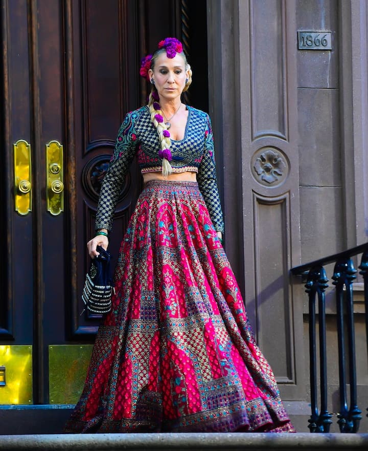 The Lehenga is styled with a handcrafted, full sleeves, cropped corset blouse. [pic credit: Gettyimages]