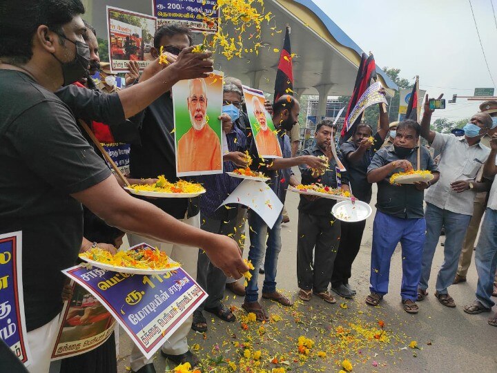 பெட்ரோல், டீசல் விலை உயர்த்தியதற்காக பிரதமர் படத்திற்கு மலர் தூவி வாழ்த்து - தபெதிகவினர் கைது