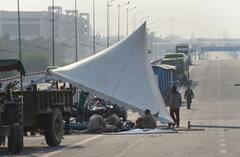 IN PICS | Delhi Police Remove Barricades From Ghazipur Protest Site, Farmers Say 'Will Go To Parliament'