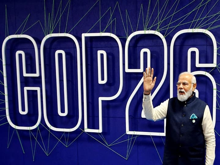 Prime Minister Modi will be presenting the formal position on India's climate action agenda and lay out the best practices and achievements in the sector at the COP26 summit. (Photo by PHIL NOBLE / POOL / AFP)