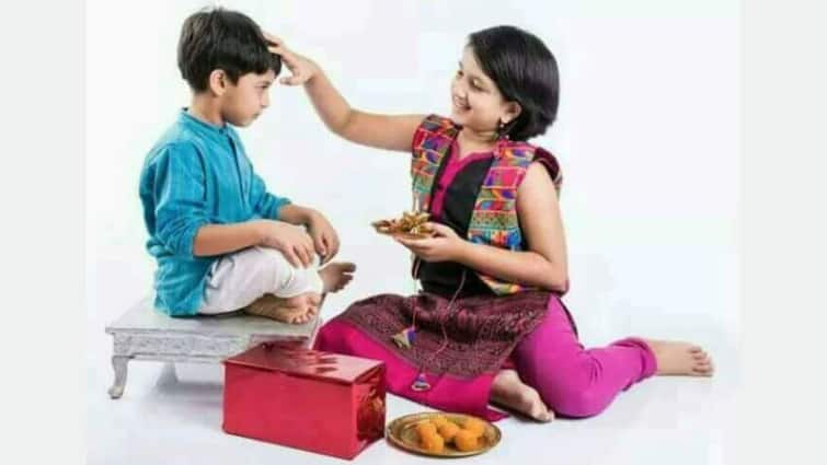 Happy Bhai Dooj 2021 best wishes in bengali images greetings messages brother sister Bhai Phota 2021 Wishes: রাত পোহালেই ভাইফোঁটা, কীভাবে শুভেচ্ছা জানাবেন ভাইকে?
