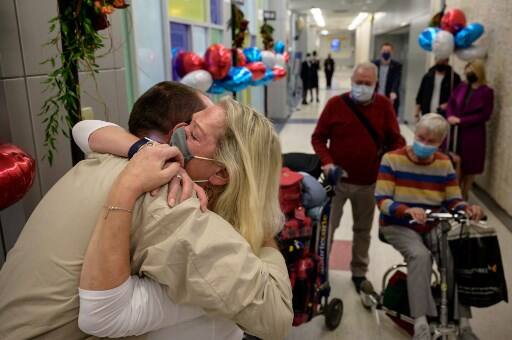 Mother embraces son at the airport after the end of 20 months of restrictions that separated families, hobbled tourism and strained diplomatic ties. Courtesy: AFP