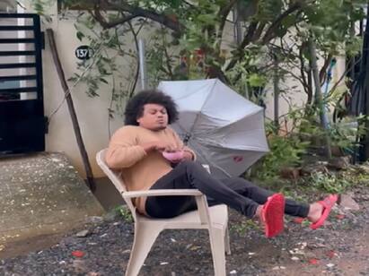 Vijay Tv Pugazh viral video about chennai rains Watch Video:புயல் காற்றில் பொரி சாப்பிட்ட புகழ் - வைரலாகும் கலகல வீடியோ!