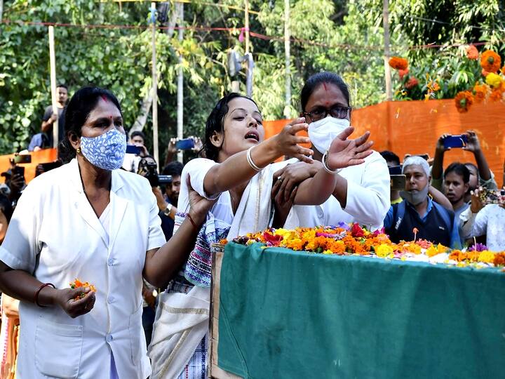 Two nurses helped Swargiary's wife to bid her final farewell as she feebly stood and saluted her slain husband, while a family member held the couple’s son in her arms and guided him to lay flowers at his father’s feet and bow his head. (PTI Photo)