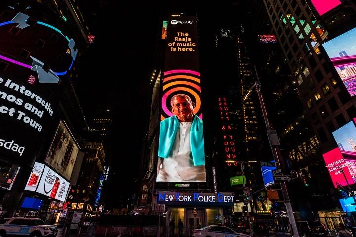 Watch Video: Music Maestro ilaiyaraaja name featured on the new york time's square Watch Video: நியூயார்க் டைம்ஸ் சதுக்கத்தில் இசையின் ராஜா! இன்னொரு மைல்கல்.. 🔥 Fire விடும் ரசிகர்கள்..