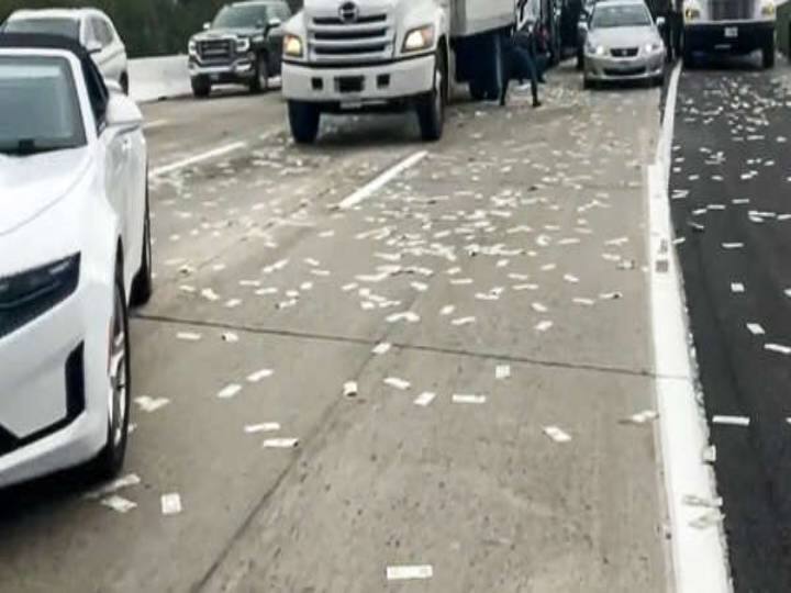 USA: Armored truck scatters banknotes on freeway in California - Watch Video Watch Video: காசு.. துட்டு.. பணமழை.. நெடுஞ்சாலை முழுக்க பறந்த பணம்.. அள்ளிச்சென்ற மக்கள்!