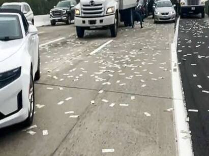 USA: Armored truck scatters banknotes on freeway in California - Watch Video Watch Video: காசு.. துட்டு.. பணமழை.. நெடுஞ்சாலை முழுக்க பறந்த பணம்.. அள்ளிச்சென்ற மக்கள்!