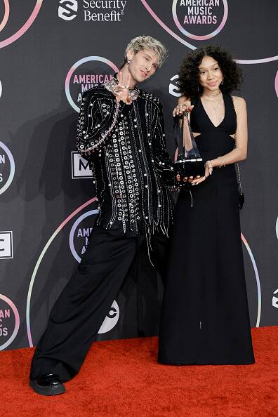 Machine Gun Kelly, winner of the Favorite Rock Artist award, poses with daughter Casie Colson Baker in the Press Room at the 2021 American Music Awards at Microsoft Theater on November 21, 2021 in Los Angeles, California. (Photo by Amy Sussman/Getty Images)
