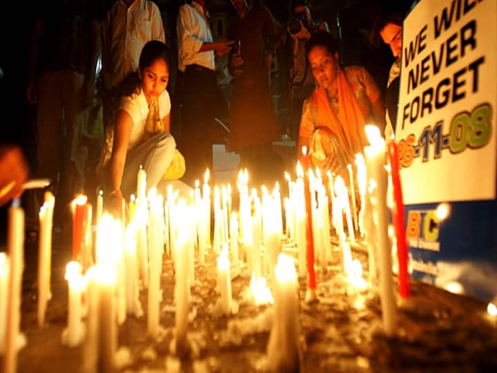 In photo dated November 26, 2009, people placed candles outside the Taj hotel in Mumbai, one of the sites of the terrorist attacks, on the first anniversary of the horrifying event. (File Photo: Getty Images)