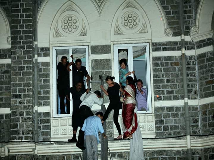 The photo dated November 27, 2008, captures hostages and guests of Hotel Taj coming out after being rescued from terrorists in Mumbai. (File Photo: Getty Images)