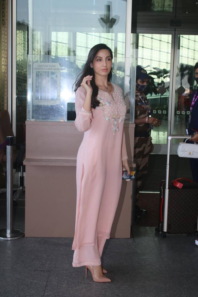 Nora Fatehi stuns at the airport in a pistachio green set with white heels  and a matching white Birkin bag : Bollywood News - Bollywood Hungama