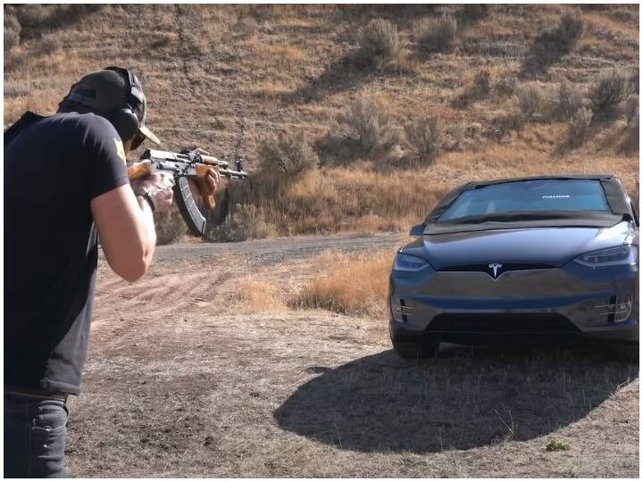 What happened when a boy fired on Tesla car with AK 47 watch full video here Tesla Model X Car Viral Video: इस शख्स ने Tesla Car पर चला दी AK47 से ताबड़तोड़ गोलियां, ऐसा हुआ इतनी महंगी गाड़ी का हाल