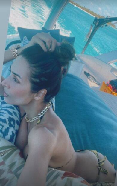 Malaika shared a stunning pic posing in a printed black and yellow itsy-bitsy bikini set which is setting the gram on fire!