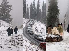 तस्वीरें: सफेद चादर से ढका जम्मू कश्मीर का गुलमर्ग, बर्फबारी का आनंद लेने पहुंचने लगे सैलानी